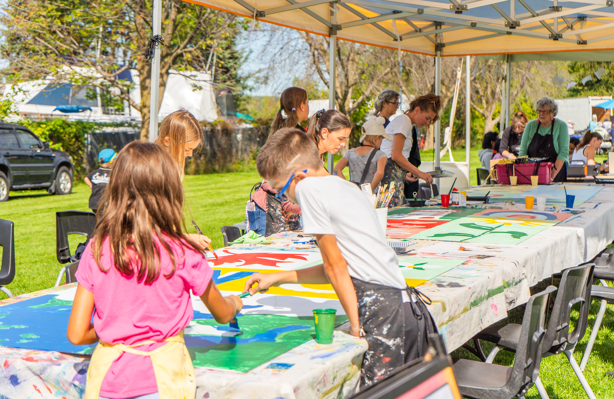 Children painting at Midland Mural Festival